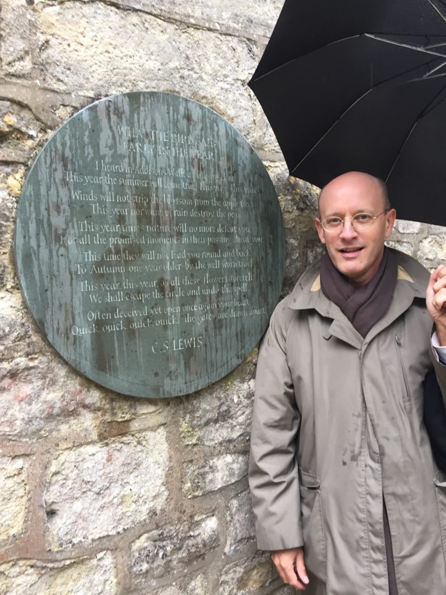 Fr. Michael Ward in front of the C.S. Lewis poem he helped install on Addison's Walk